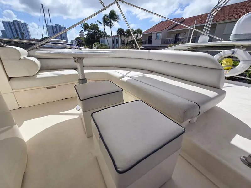 Slide: The Image of 1998 Viking Princess 56 Sport Cruiser with white leather seating and outdoor view. - 19