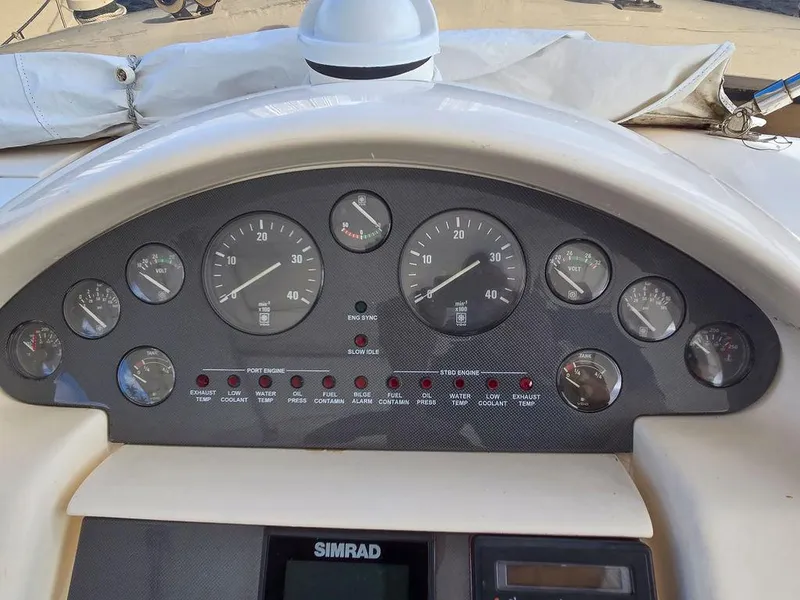 Slide: The Image of Dashboard of a 1998 Viking Princess 56 Sport Cruiser with gauges and controls. - 26