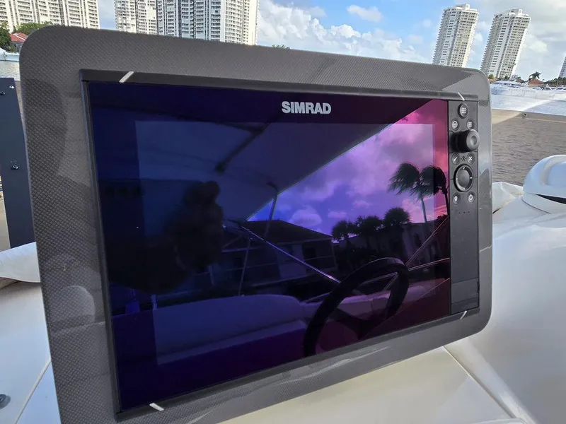 Slide: The Image of Simrad navigation display on 1998 Viking Princess 56 Sport Cruiser yacht, with cityscape background. - 28