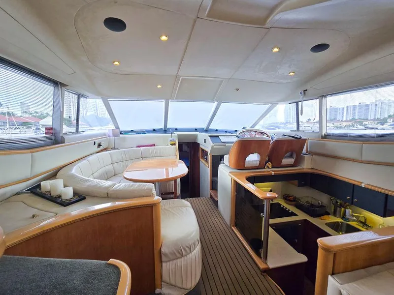 Slide: The Image of Luxurious interior of a 1998 Viking Princess 56 Sport Cruiser yacht with elegant seating and helm. - 36