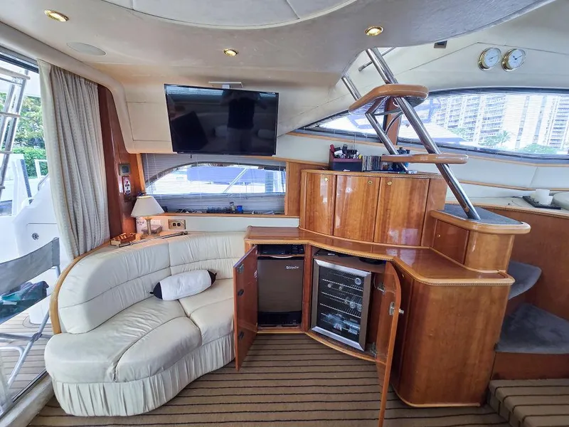 Slide: The Image of Luxurious interior of 1998 Viking Princess 56 Sport Cruiser with elegant wood cabinetry and plush seating. - 40