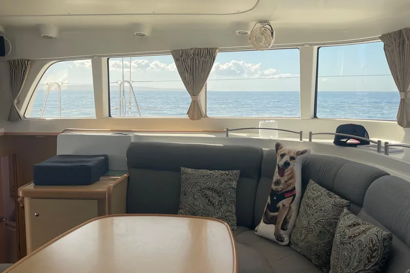 Slide: The Image of Interior of 2010 Lagoon 440 yacht with ocean view and cozy seating area. - 24