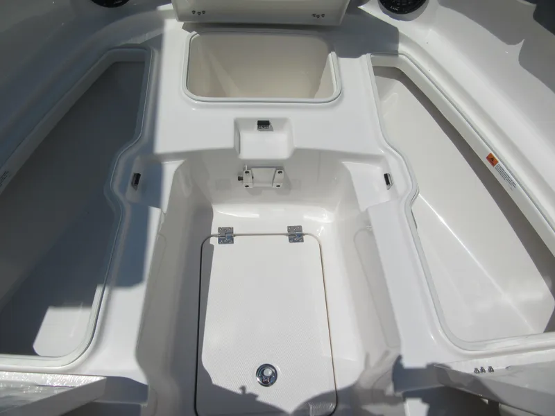 Slide: The Image of 2025 Robalo R257 Dual Console boat interior storage compartments. - 10