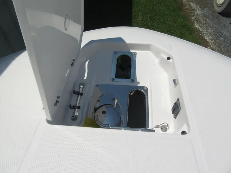 Slide: The Image of 2025 Robalo R257 Dual Console anchor storage compartment with open hatch. - 13
