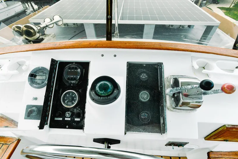 Slide: The Image of 1984 Kadey-Krogen Krogen 42 Trawler helm with gauges and controls. - 14