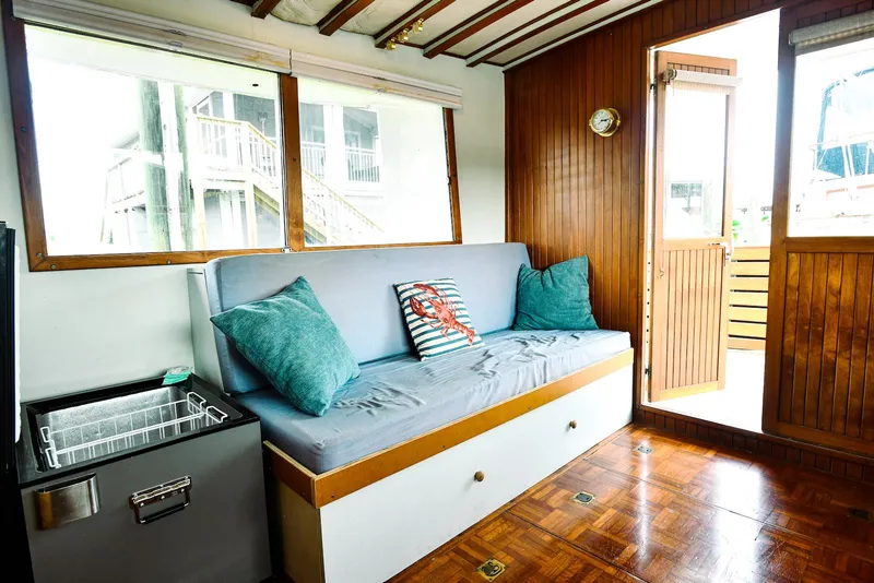 Slide: The Image of Interior of 1984 Kadey-Krogen Krogen 42 Trawler with wooden paneling and cushioned seating. - 18