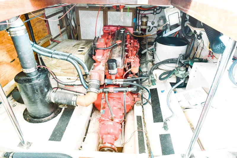 Slide: The Image of Engine room of 1984 Kadey-Krogen Krogen 42 Trawler with visible red engine components. - 30