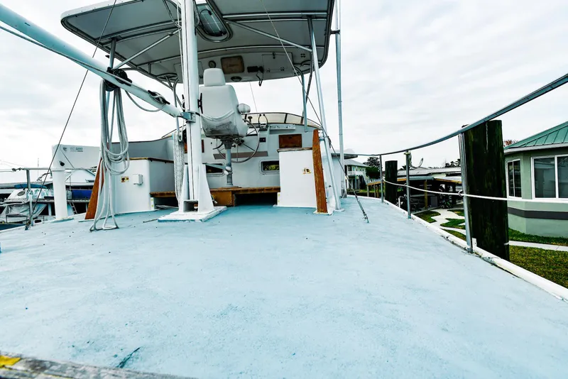 Slide: The Image of 1984 Kadey-Krogen Krogen 42 Trawler deck view with helm and seating area. - 6