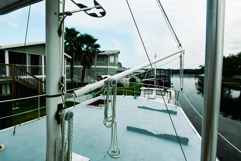 Slide: The Image of 1984 Kadey-Krogen Krogen 42 Trawler docked near waterfront homes. - 8