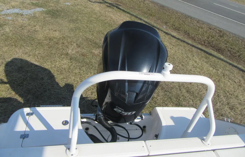 Slide: The Image of 2020 Robalo R230 Center Console boat with powerful outboard motor on grassy area. - 10