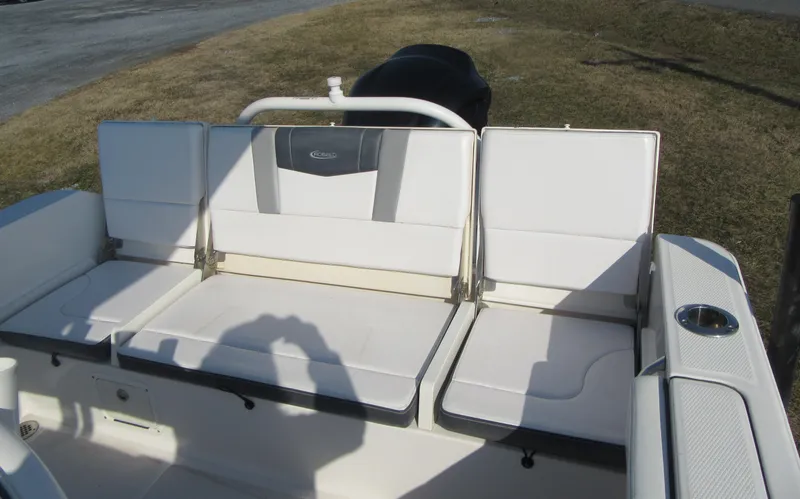 Slide: The Image of 2020 Robalo R230 Center Console boat seating area with white cushions. - 11