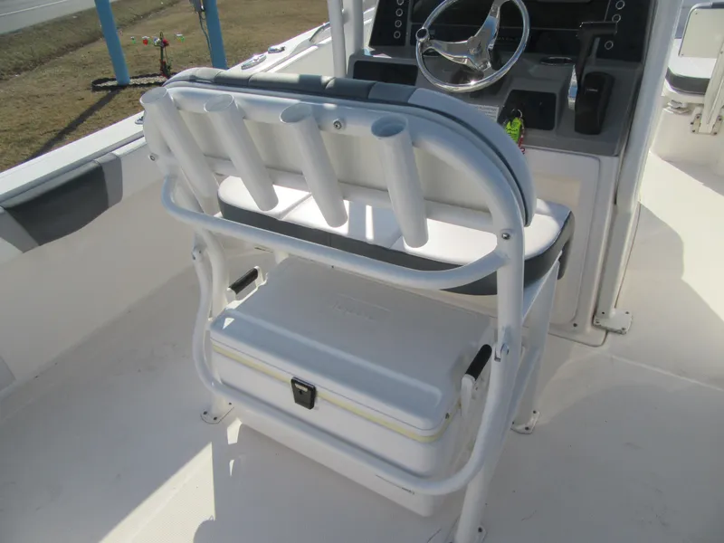 Slide: The Image of 2020 Robalo R230 Center Console boat with rod holders and cooler seat. - 14