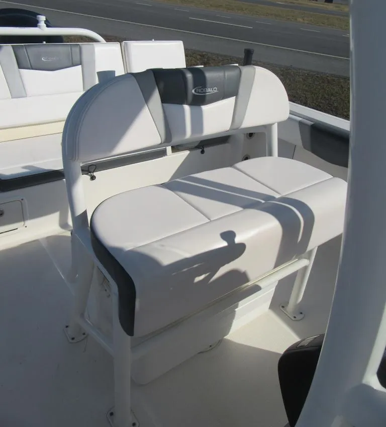 Slide: The Image of 2020 Robalo R230 Center Console boat seating, white and gray upholstery. - 15