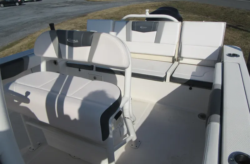 Slide: The Image of 2020 Robalo R230 Center Console boat interior with white seating and console. - 16