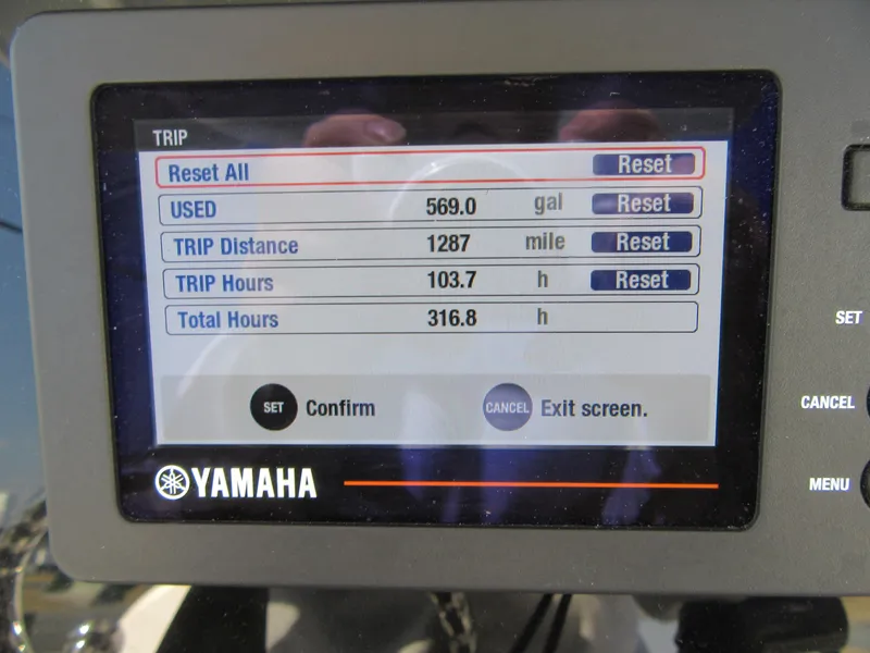 Slide: The Image of Yamaha display showing trip data: 569 gallons used, 1287 miles, 103.7 trip hours. - 19