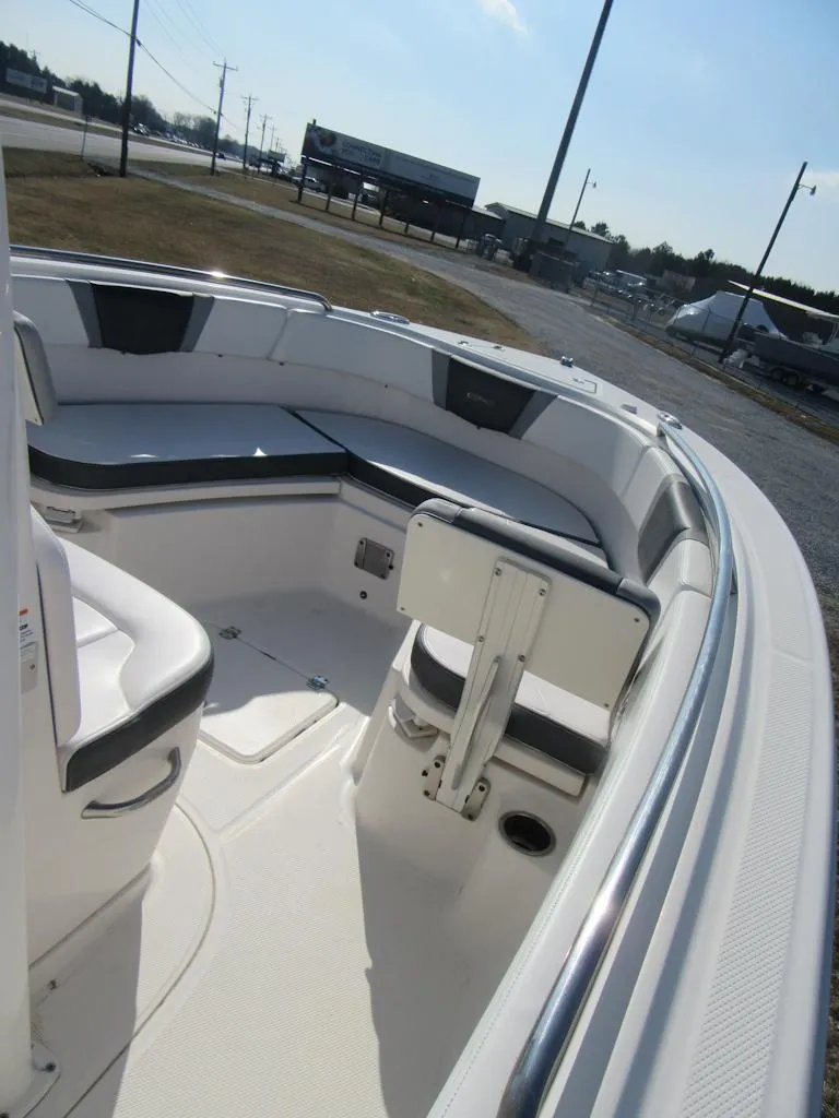 Slide: The Image of 2020 Robalo R230 Center Console boat interior with seating and storage. - 22