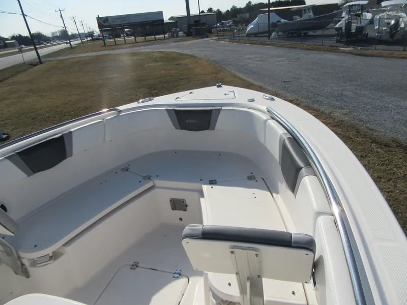 Slide: The Image of 2020 Robalo R230 Center Console boat interior with seating and storage. - 26