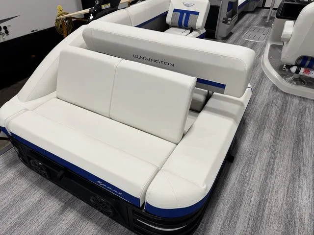 Slide: The Image of 2025 Bennington M Swingback 26 MSB boat interior with white and blue seating. - 10