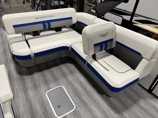 Slide: The Image of 2025 Bennington M Swingback 26 MSB boat seating with blue accents and modern design. - 12