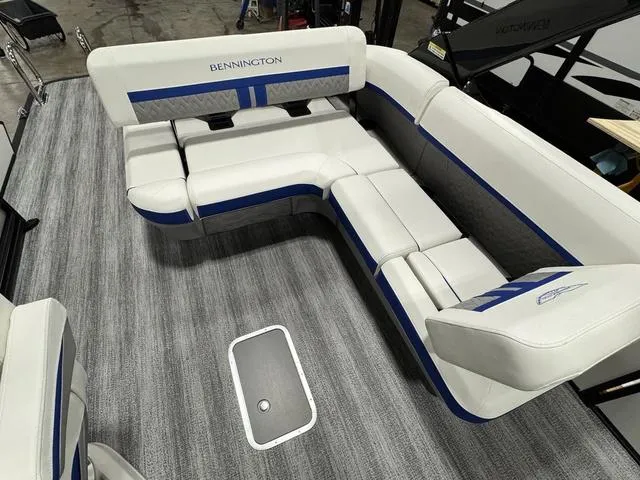 Slide: The Image of 2025 Bennington M Swingback 26 MSB boat interior with white and blue seating. - 13