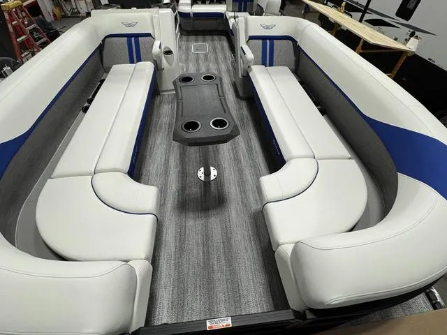Slide: The Image of 2025 Bennington M Swingback 26 MSB pontoon boat interior with spacious seating and cup holders. - 20