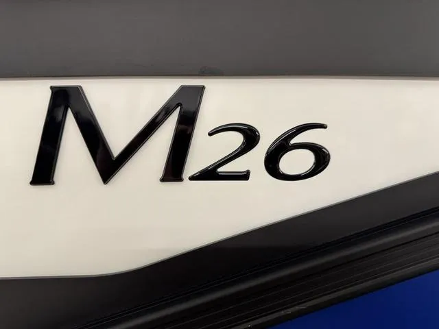 Slide: The Image of Close-up of 2025 Bennington M Swingback 26 MSB logo on boat exterior. - 25
