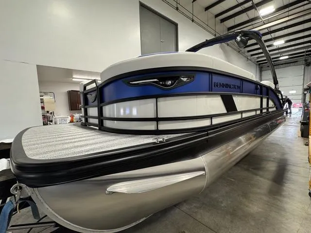 Slide: The Image of Hawkeye Boat Sales dealership at sunset, Dubuque, Iowa, featuring Bennington M Swingback 26 MSB. - 4