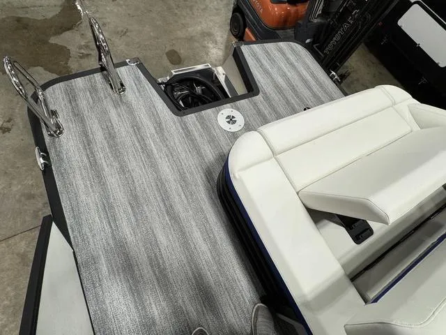 Slide: The Image of 2025 Bennington M Swingback 26 MSB boat interior with sleek seating and modern flooring. - 8