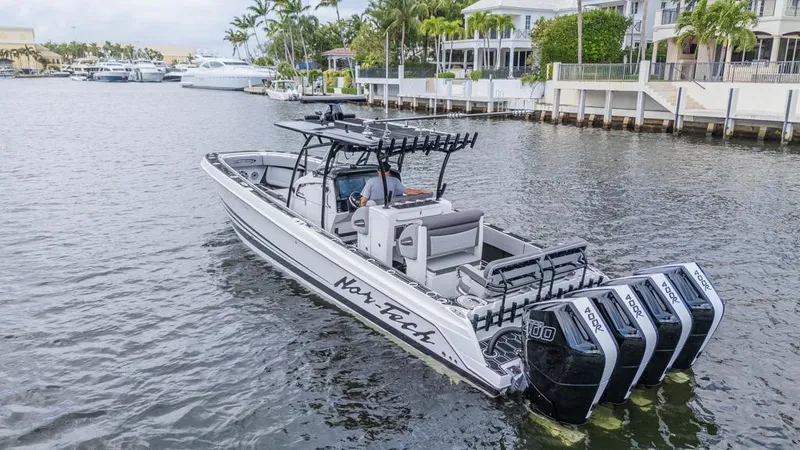 The Image of 2024 Nor-Tech 392 Super Fish boat with quad engines on a calm waterway. - 0