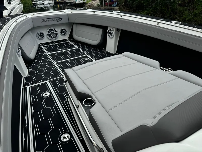 Slide: The Image of 2024 Nor-Tech 392 Super Fish boat interior with sleek seating and modern design. - 15