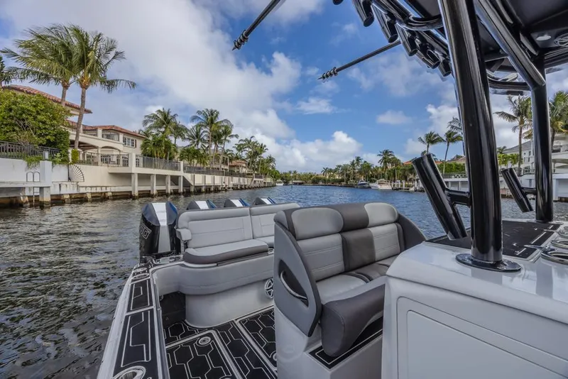 Slide: The Image of 2024 Nor-Tech 392 Super Fish boat interior on a scenic waterfront. - 24