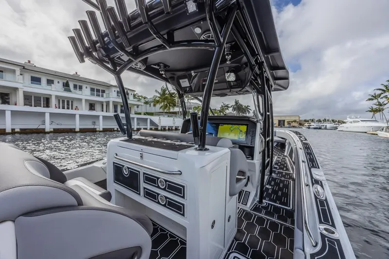 Slide: The Image of 2024 Nor-Tech 392 Super Fish boat interior with advanced navigation system and luxurious seating. - 32