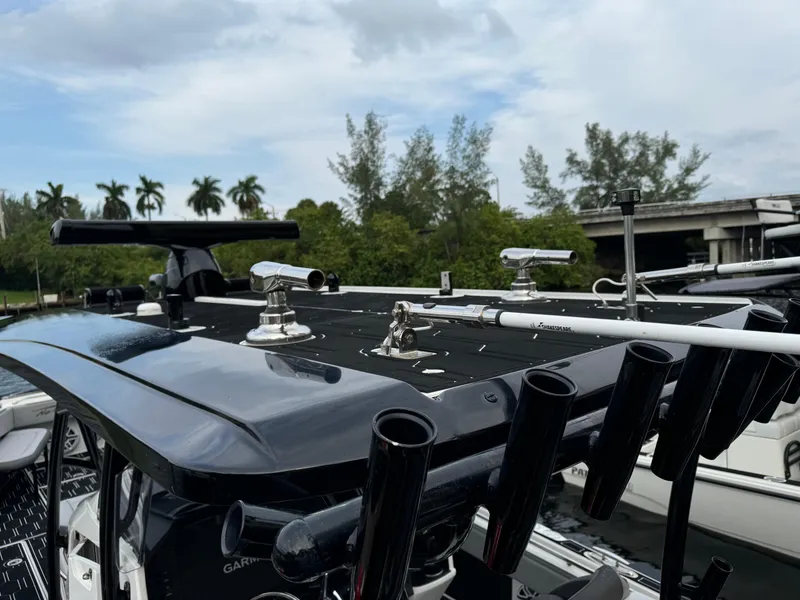 Slide: The Image of 2024 Nor-Tech 392 Super Fish boat with fishing rod holders and equipment on deck. - 41