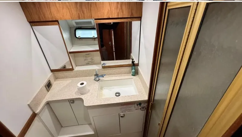Slide: The Image of 1987 Blackfin Convertible yacht bathroom with sink, mirror, and shower. - 41