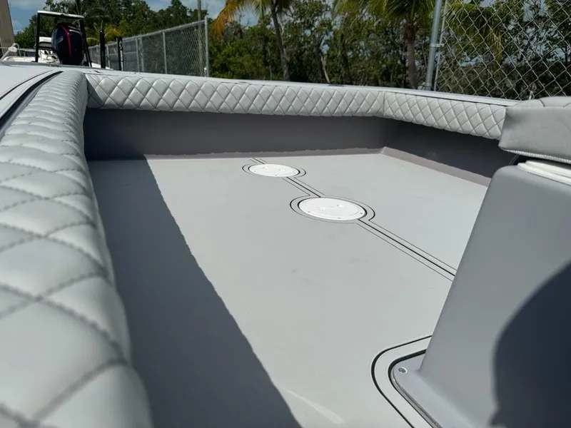 Slide: The Image of 2023 Custom Key Hopper 20 boat interior with quilted upholstery and sleek design. - 11