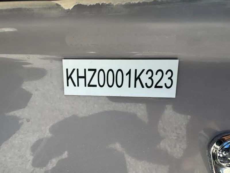 Slide: The Image of Custom Key Hopper 20, 2023 model, with label "KHZ0001K323" on a gray surface. - 12