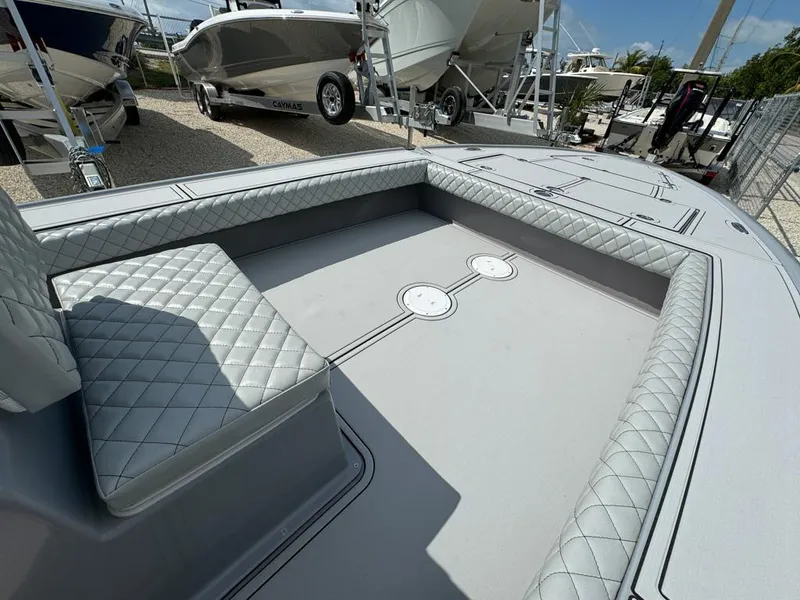 Slide: The Image of Custom Key Hopper 20 boat interior, 2023 model, featuring quilted seating and spacious deck area. - 9