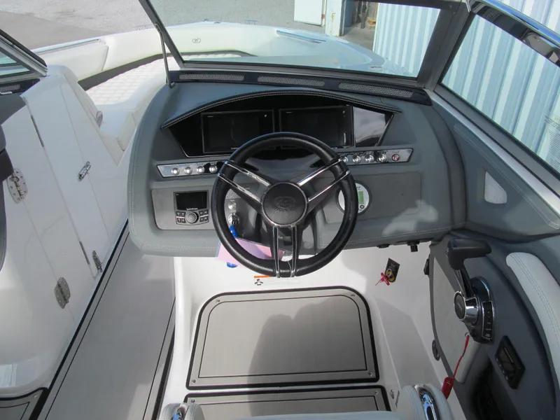 Slide: The Image of 2019 Cobalt R7 Surf boat dashboard with steering wheel and control panel. - 10