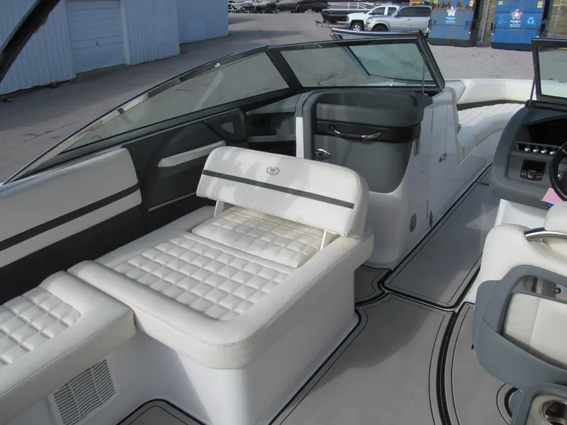 Slide: The Image of 2019 Cobalt R7 Surf boat interior with white cushioned seating and sleek design. - 11
