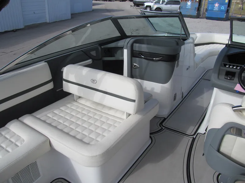 Slide: The Image of 2019 Cobalt R7 Surf boat interior with white seating and modern dashboard design. - 12