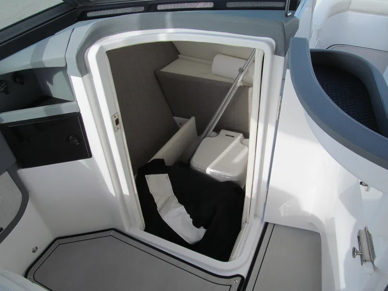 Slide: The Image of 2019 Cobalt R7 Surf boat interior storage compartment with portable toilet. - 13