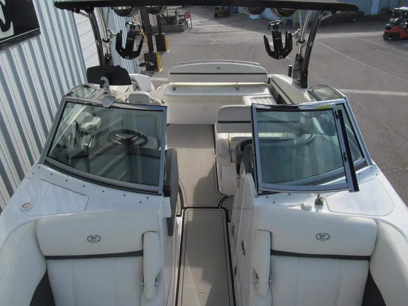 Slide: The Image of 2019 Cobalt R7 Surf boat interior with white seating and open windshield. - 17