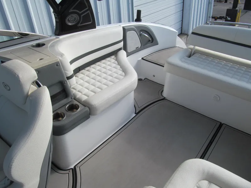 Slide: The Image of 2019 Cobalt R7 Surf boat interior with plush seating and cup holders. - 19