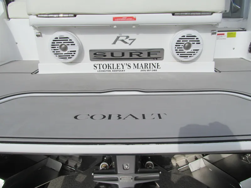 Slide: The Image of 2019 Cobalt R7 Surf boat deck with speakers, Stokley's Marine branding. - 22