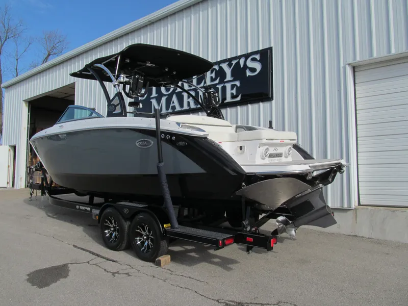 Slide: The Image of 2019 Cobalt R7 Surf boat on trailer outside a marine shop. - 3