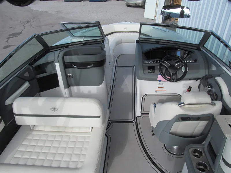 Slide: The Image of 2019 Cobalt R7 Surf boat interior with white seating and modern dashboard. - 9