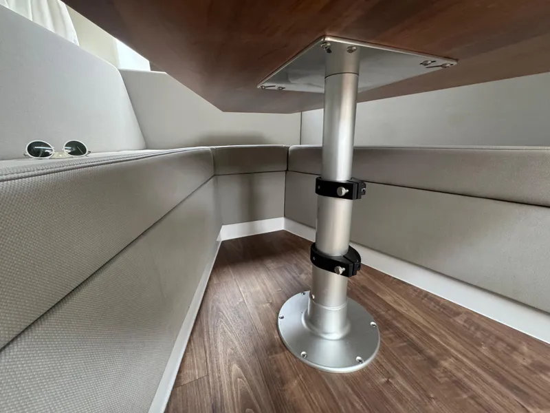 Slide: The Image of Interior seating area of 2020 Cruisers Yachts 39 Express Coupe with wood flooring. - 29