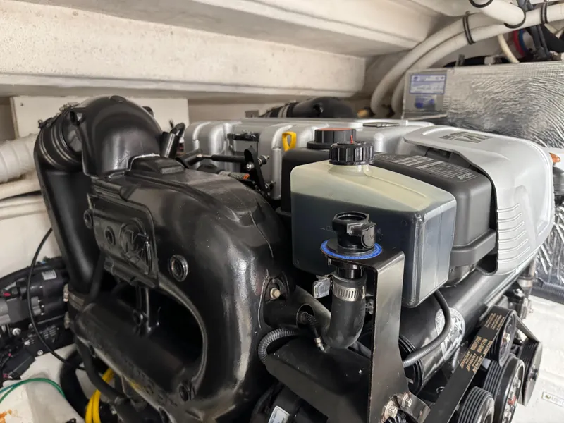 Slide: The Image of Engine compartment of 2020 Cruisers Yachts 39 Express Coupe, showcasing detailed machinery. - 30