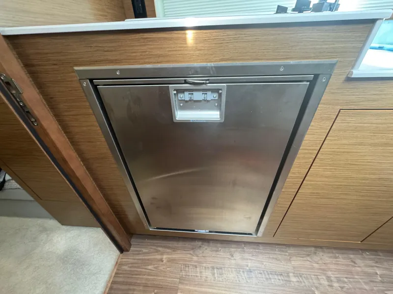 Slide: The Image of Built-in stainless steel appliance in 2020 Cruisers Yachts 39 Express Coupe interior. - 46