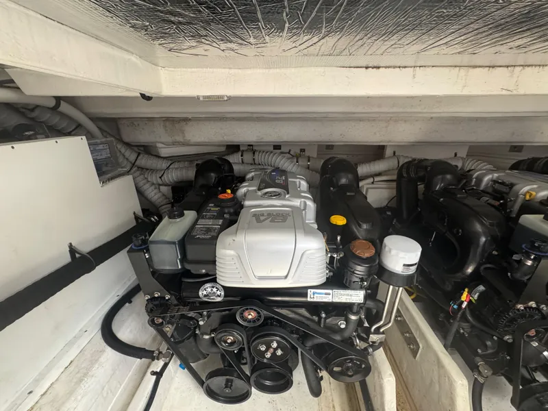 Slide: The Image of Engine compartment of 2020 Cruisers Yachts 39 Express Coupe, showcasing detailed mechanical components. - 47